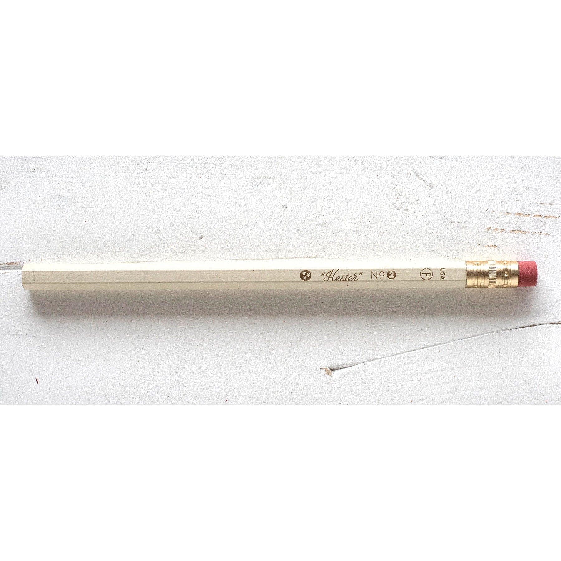 A Hester &amp; Cook Jumbo Hex Pencil on a white surface.