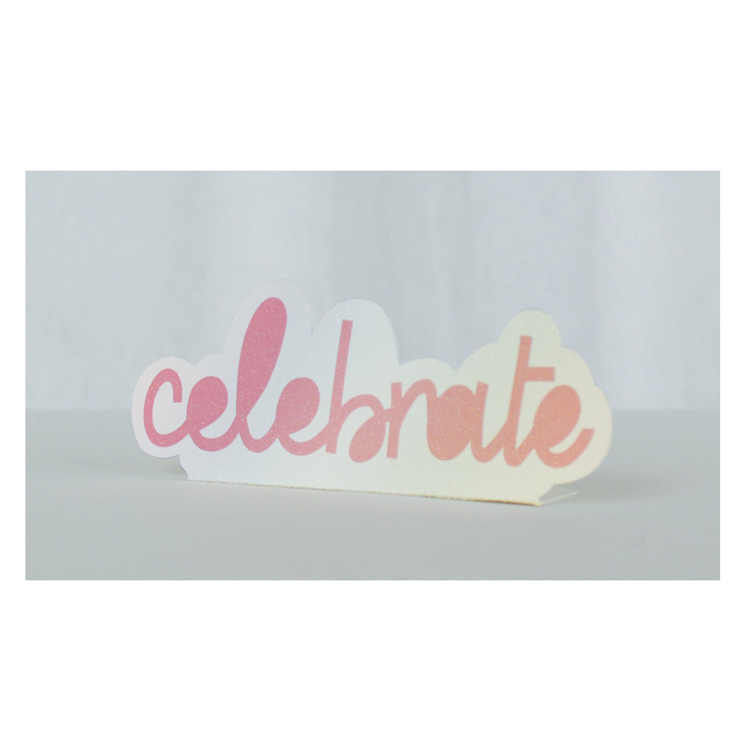 Decorative &quot;Hester &amp; Cook Celebrate Pop Up Tag&quot; with script font displayed against a plain background.
