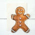 A Gingerbread Man card from the Hester & Cook Gingerbread Man Boxed Set Cards, with white icing details and red swirls on a white background.