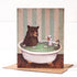 A whimsical Bathtime Card by Hester & Cook featuring an original artwork by Elizabeth Foster, illustrating a bear and a bird taking a bath together in a claw-foot tub.