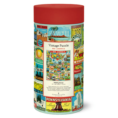 A round red and white See America Puzzle container with a map of the United States, featuring vintage illustrations by Cavallini Papers &amp; Co.