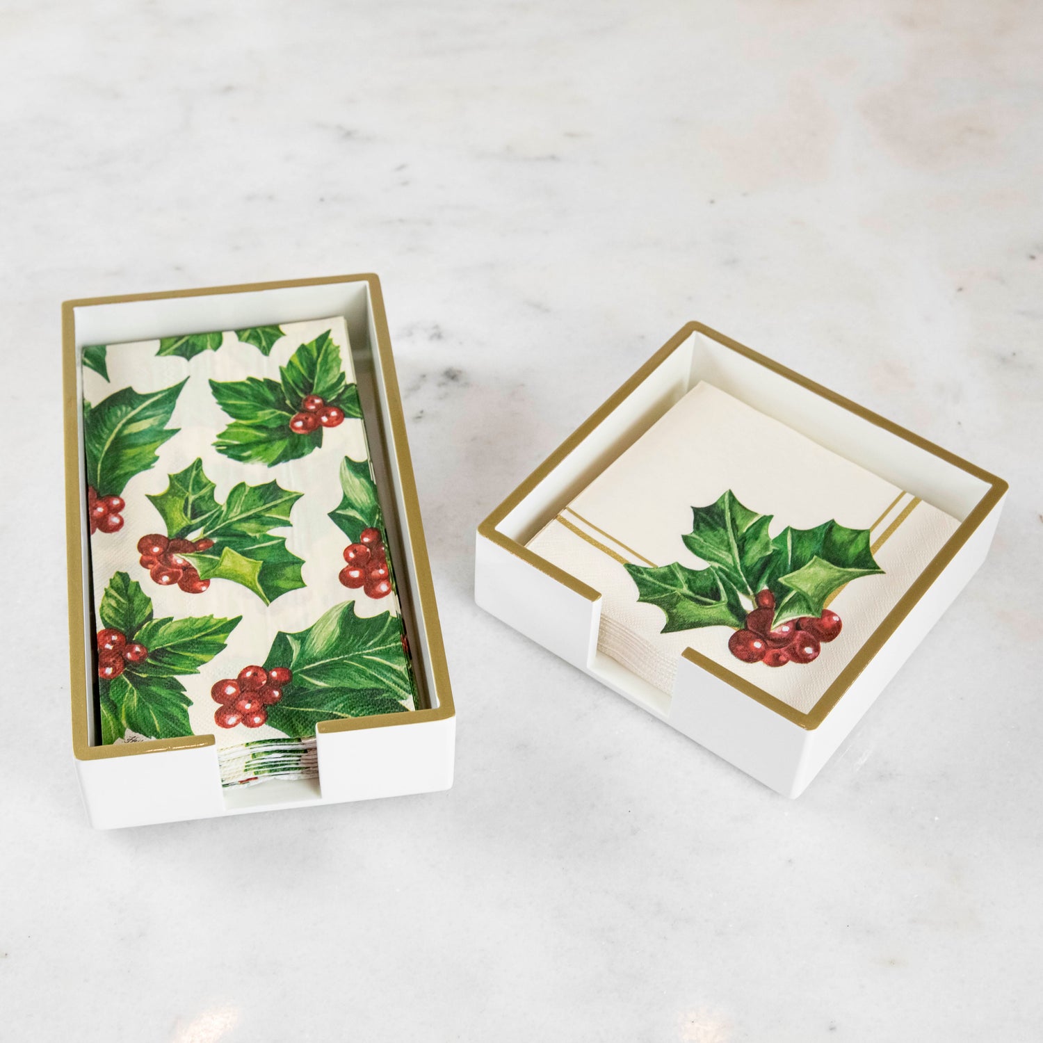 White lacquered guest and cocktail napkin holders with napkins inside.