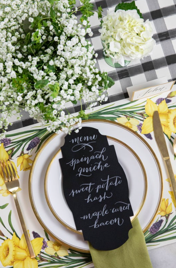 The Black Painted Check Runner under an elegant floral place setting, from above.