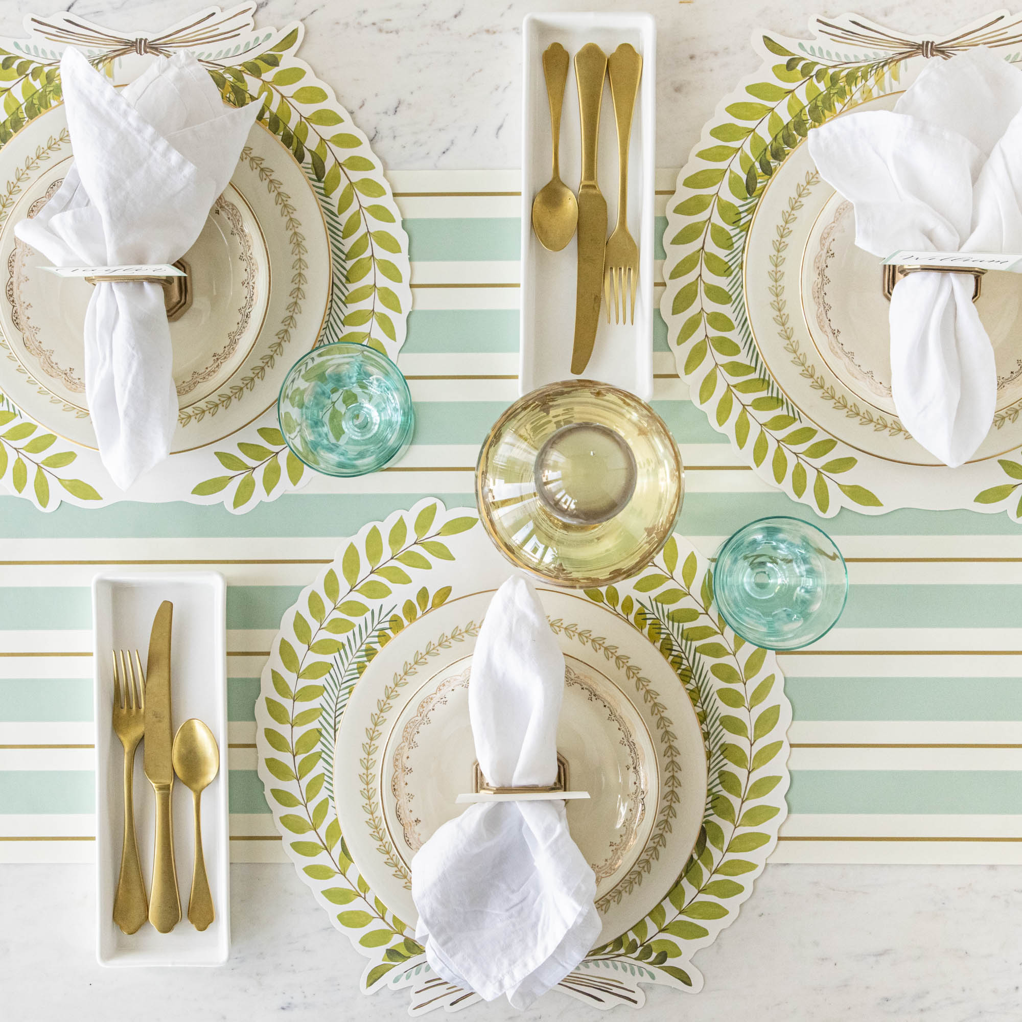 The Seafoam &amp; Gold Awning Stripe Runner under an elegant table setting, from above.