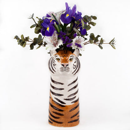 An eye-catching Tiger Ceramic vase filled with vibrant purple flowers, showcasing the creativity and uniqueness of Quail Ceramics, a British brand known for their quirky pieces.