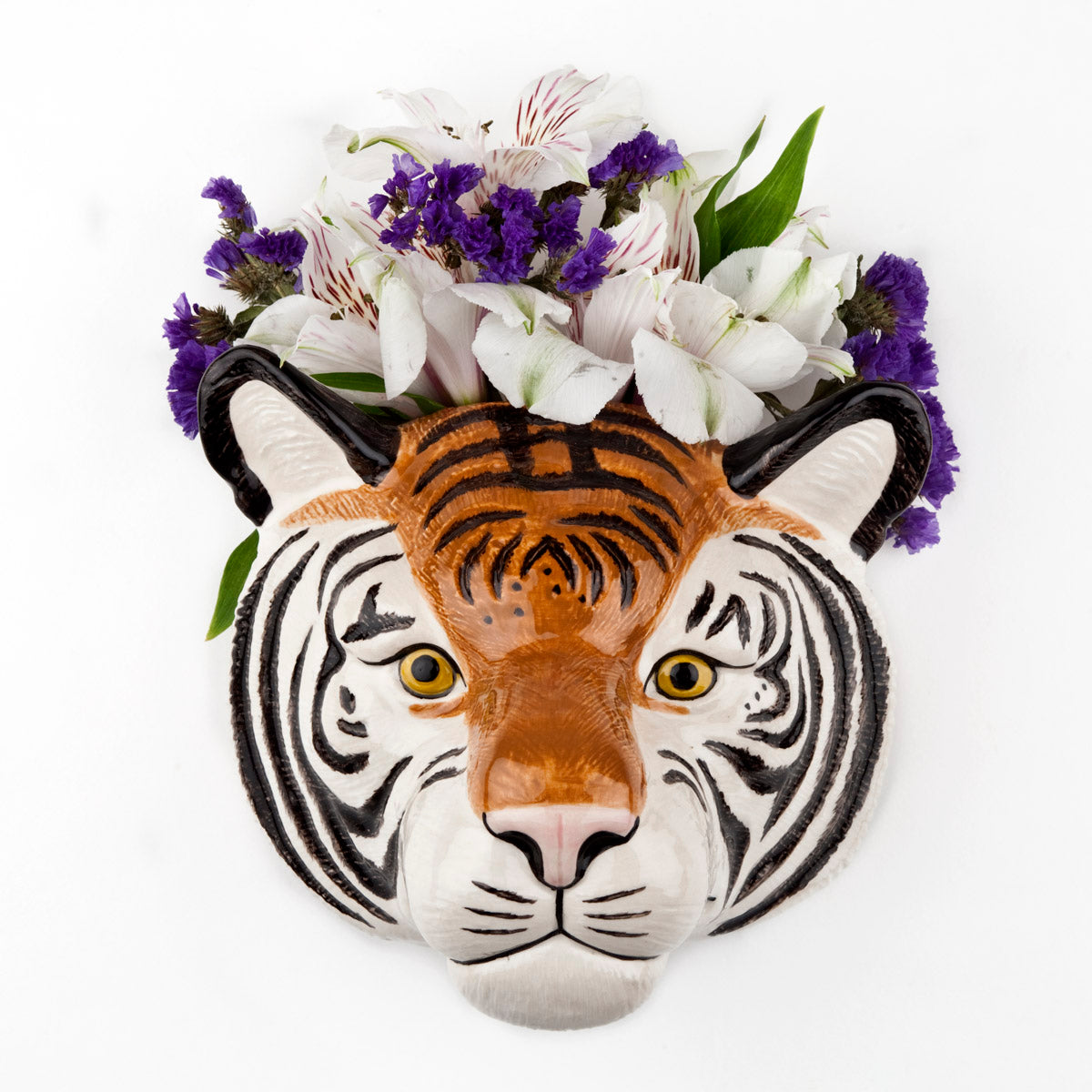 A quirky Tiger Ceramic with flowers in it, crafted by Quail, a British brand known for their unique and eccentric pieces.