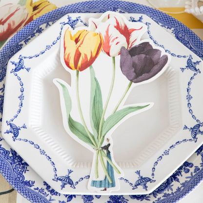 A blue and white Tulips Table Accent plate with tulips on it, perfect for adding a splash of color to any table.