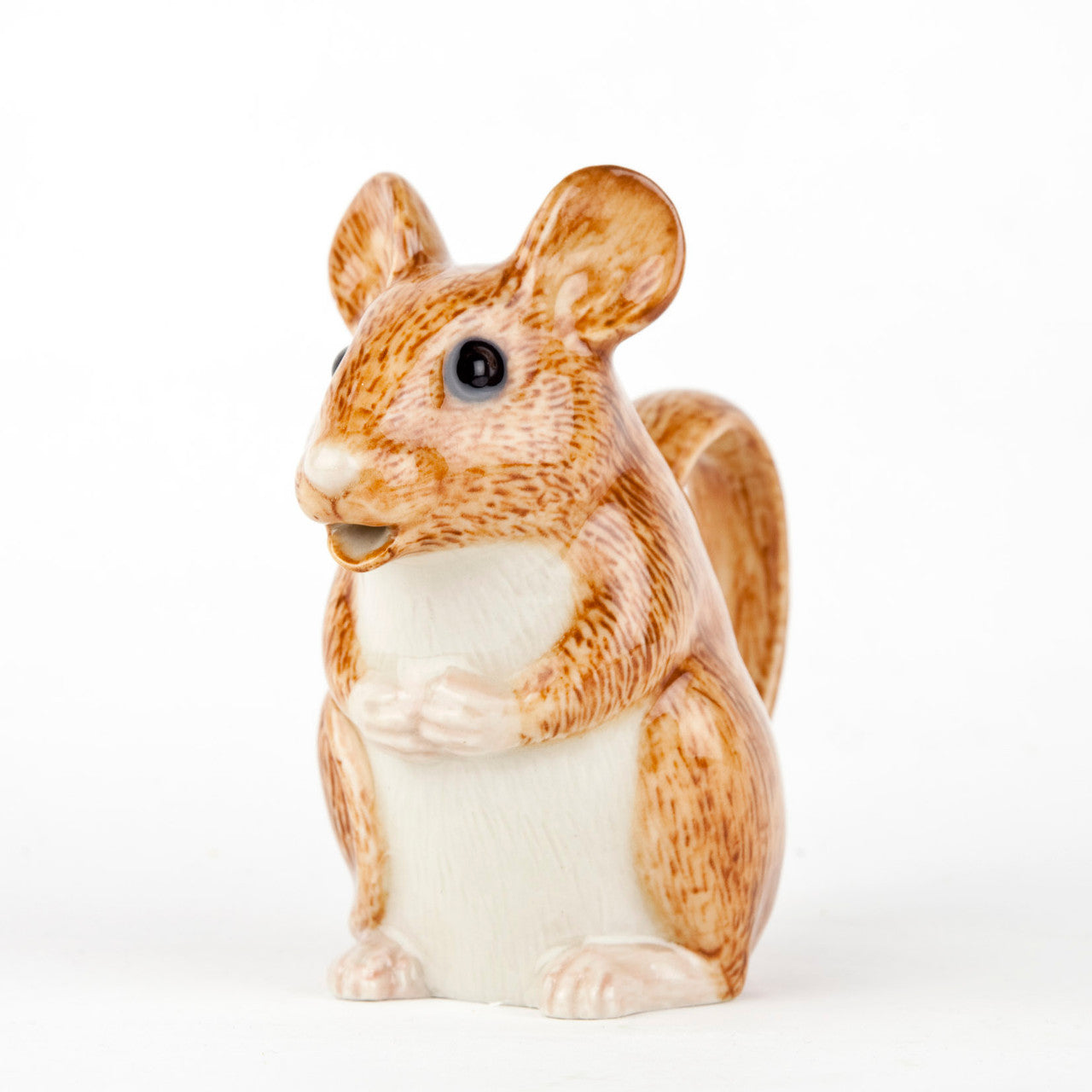 A small figurine of a Woodland Animal Jug sitting on a white background designed by Quail, a British brand known for their traditional British designs.