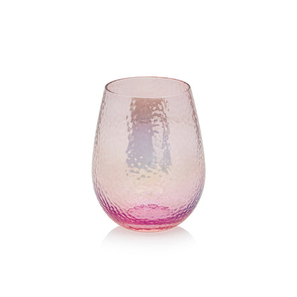 A pink and purple Luster Stemless Glassware wine glass on a white surface from Zodax.
