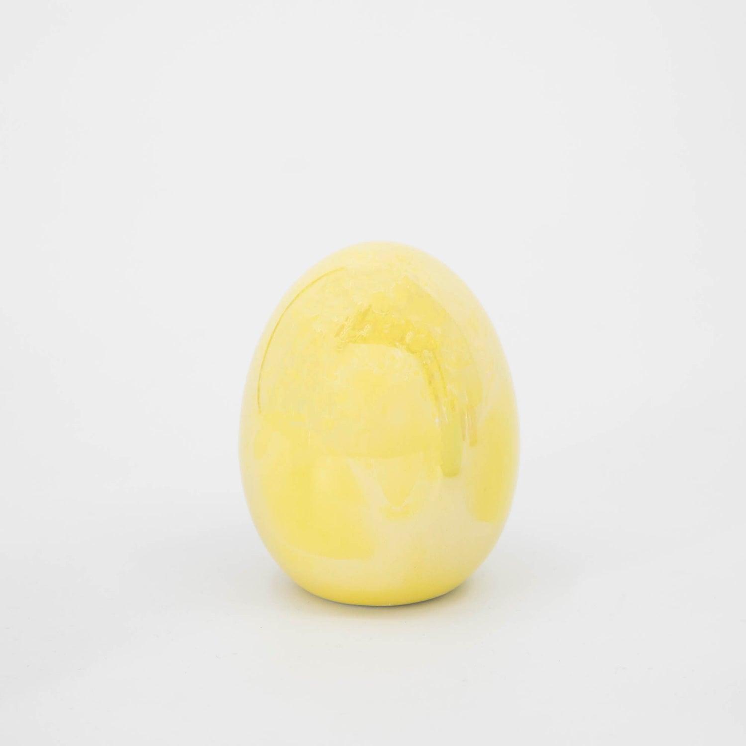 A Small Iridescent Egg decorated for Easter on a white background by Glitterville.