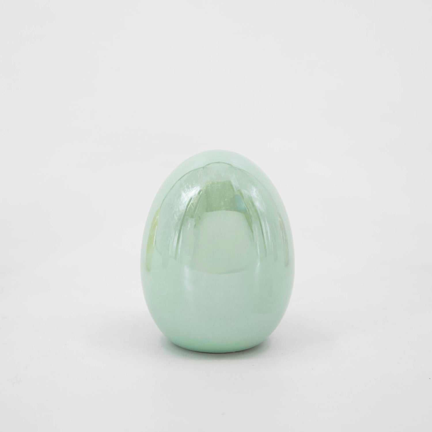A Small Iridescent Easter egg on a white background from Glitterville.