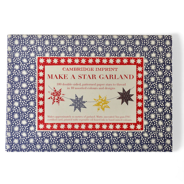 A craft kit titled &quot;Make a Star Garland&quot; by Cambridge Imprint displayed on a shelf with FSC-certified card, star decorations around.