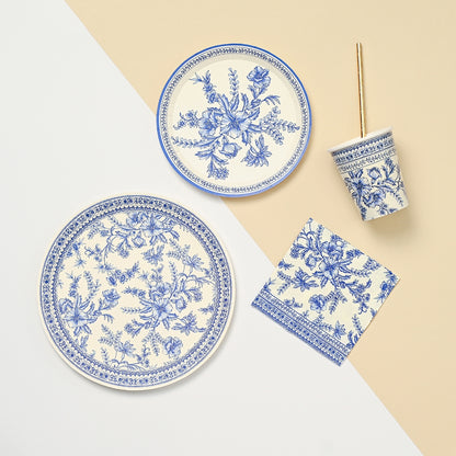 A set of Blue French Toile Paper Party Dinnerware inspired by the French countryside and provided by Coterie Party Supplies.
