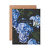 A folded Cheering For You Hydrangea Card with blue hydrangea flowers and the text "{cheering for you}" placed on a beige background, printed on high quality uncoated stock by The Pen + Piper.