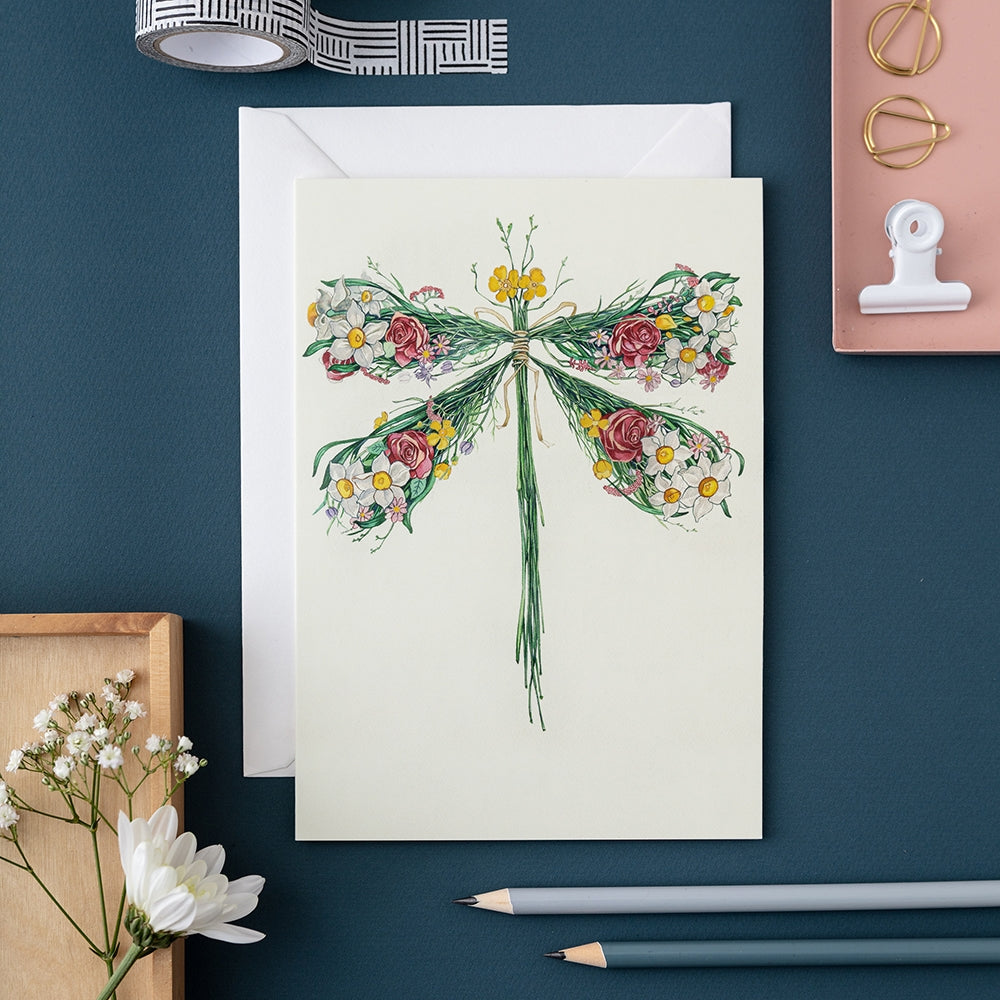 An artistically crafted Dragonfly Card by The DM Collection, featuring a beautiful dragonfly showcased in a stunning watercolour painting. Perfect for sending heartfelt messages and well wishes.