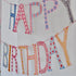 A Cambridge Imprint birthday banner hanging on a wall.