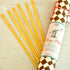 A set of Tops Malibu Conversation Game Talking Sticks for a meaningful conversation game, with one rolled-up prompt guide next to them, perfect for any gathering with friends.
