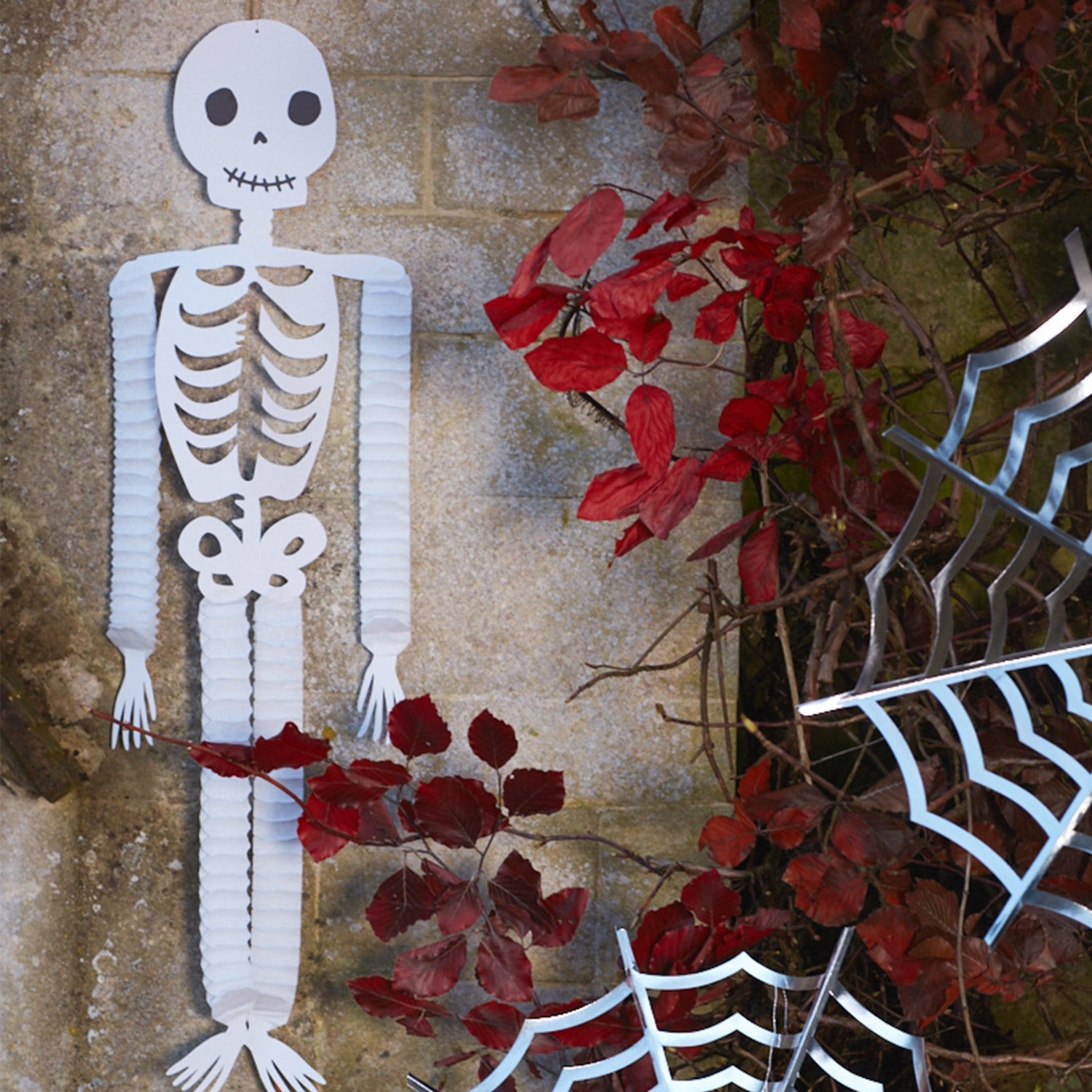 outside Halloween decor with skeleton honeycomb decoration