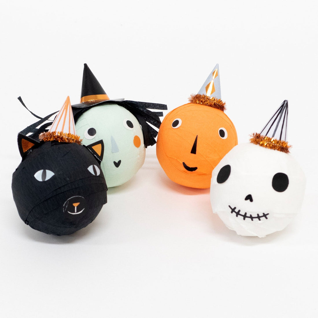 Four surprise balls; a witch, skull, black cat and pumpkin, all with charming little hats with copper foil detail