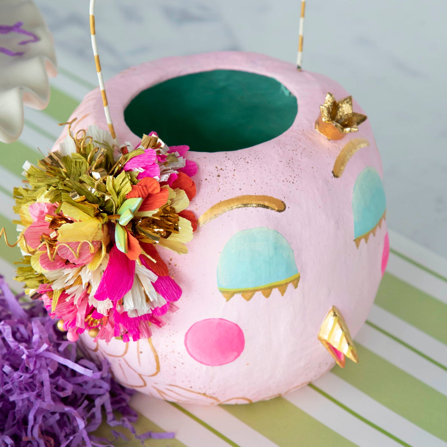 A Glitterville Papermache Easter Bucket shaped flower pot perfect for spring decor.