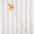 Five Glitterville Magic Wands on a striped background.