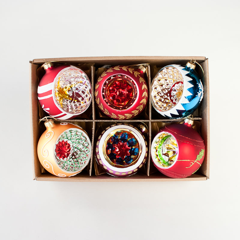 The Reflector Ornaments Set of 6 in a kraft box.