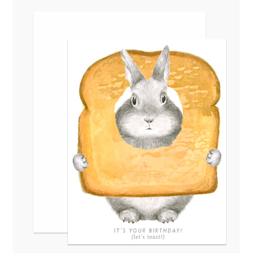 A birthday card with an illustration of a rabbit inside a slice of toast, with the text &