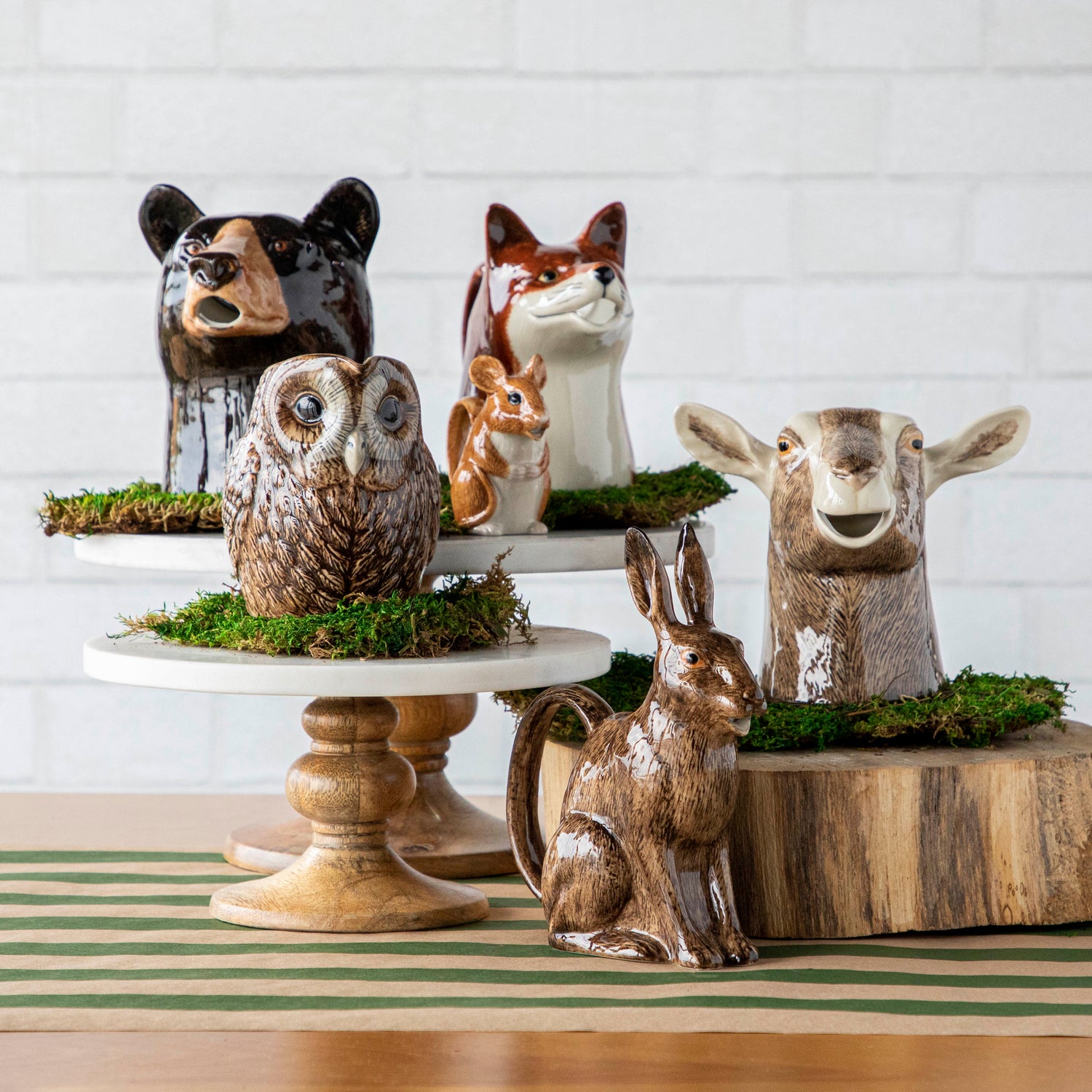 A group of Woodland Animal Jugs by Quail, a popular British brand, displayed on top of a table.